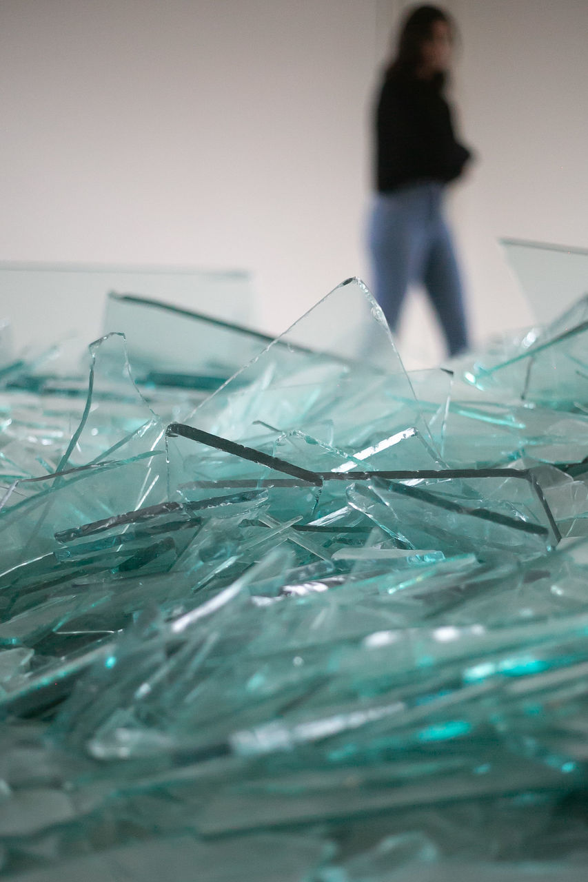 CLOSE-UP OF GLASS OF WOMAN IN PLASTIC