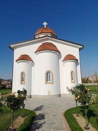 View of temple against building