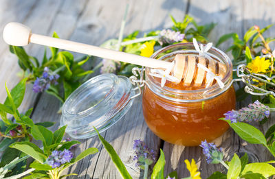 High angle view of honey in glass jar on table