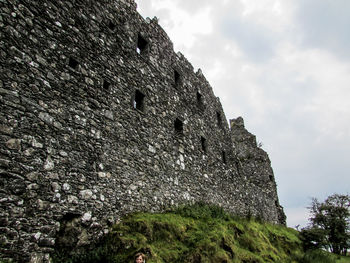 Low angle view of old building against sky