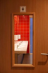 Washbasin in public restroom seen from door