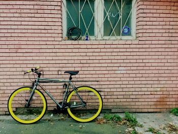 Bicycle against brick wall