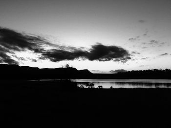 Scenic view of landscape against sky at sunset