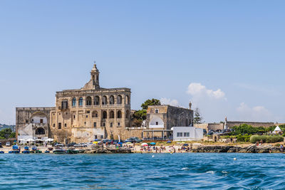 View of buildings against blue sky