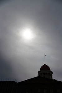 Low angle view of silhouette building against sky