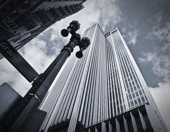 Low angle view of building against cloudy sky