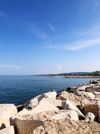 Scenic view of sea against blue sky