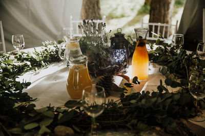 Close-up of wine bottles and juice on table