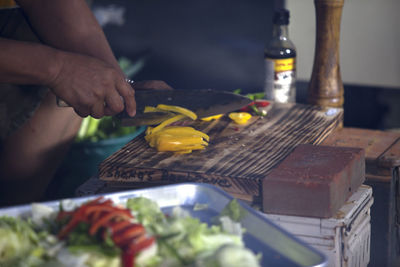 Man chopping bell pepper