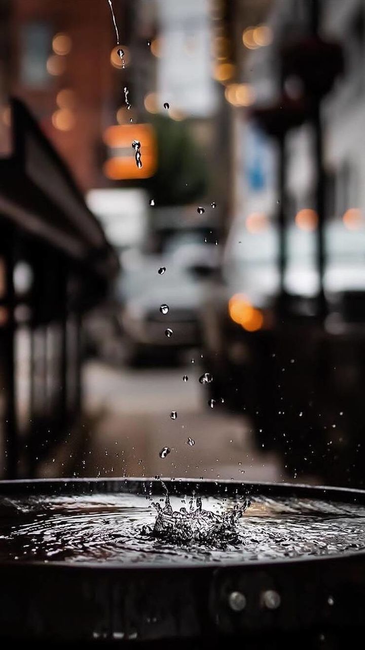 water, drop, architecture, wet, focus on foreground, rain, no people, splashing, building exterior, built structure, day, nature, close-up, motion, city, selective focus, outdoors, raindrop, rainy season, flowing, purity