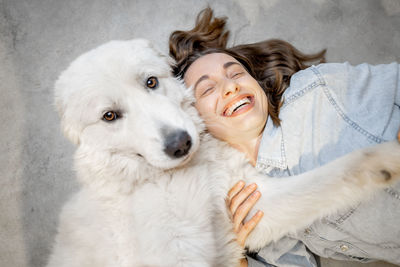 Portrait of young woman with dog