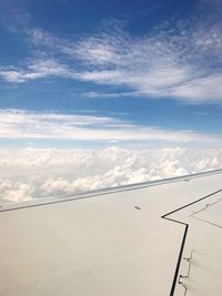 Aerial view of airplane flying in sky