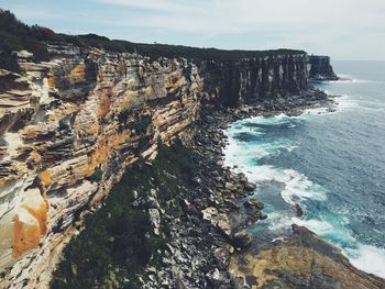 Scenic view of cliff and sea at manly beach