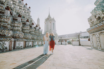 Happy women at temple in city