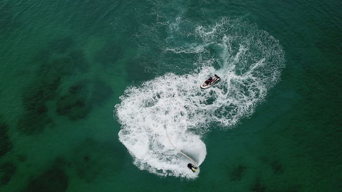 High angle view of man swimming in sea