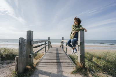 Woman on boardwalk at the beach