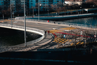 High angle view of light trails on bridge over city