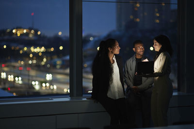 Colleagues working late in office