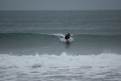 Man surfing in sea