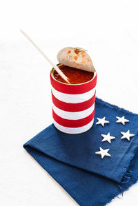 Close-up of canned food on tablecloth