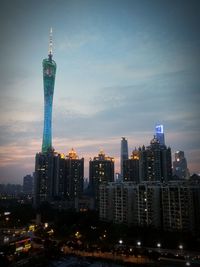 Illuminated skyscrapers in city at night