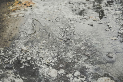 High angle view of raindrops on snow