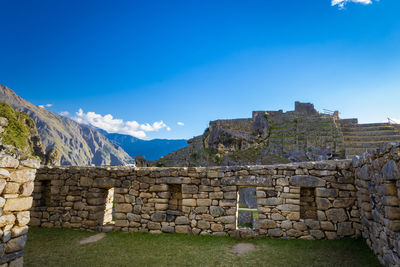 View of old ruins against blue sky