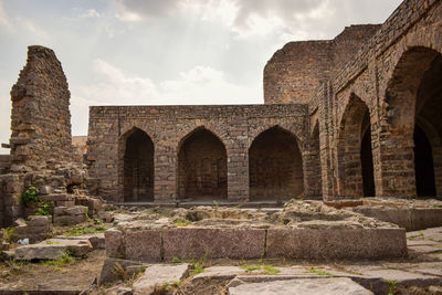 Golconda fort arch old historical in india area background stock photograph