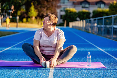 Young woman exercising in pool