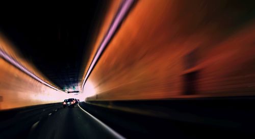 Cars moving on road in tunnel