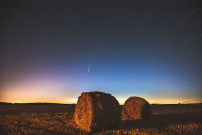 Scenic view of field against sky at night