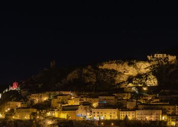 High angle view of illuminated buildings in city at night