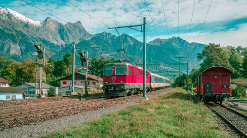 Train on railroad track against sky