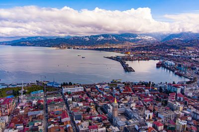 High angle view of commercial dock against cloudy sky