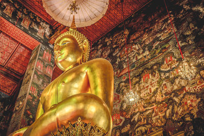 Low angle view of statue of statues in temple