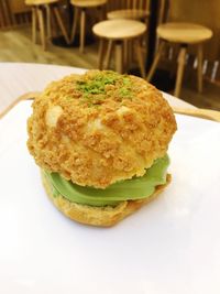 Close-up of burger in plate on table