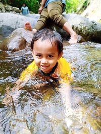 Portrait of smiling boy in water