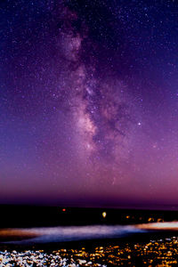 Scenic view of sea against sky at night