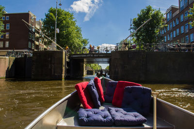 Footbridge over river against sky