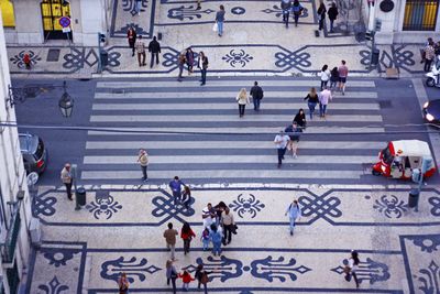 High angle view of people walking on street