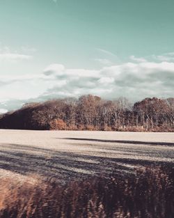 Scenic view of landscape against sky during winter