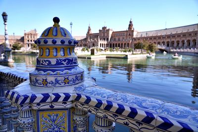 Bridge over river with buildings in background