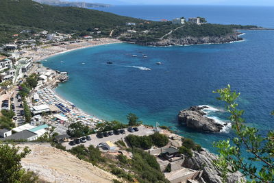 High angle view of sea and city