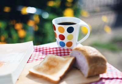 Close-up of coffee cup on table