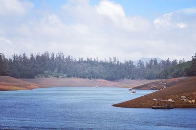 Scenic view of sea against cloudy sky