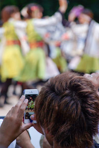 Midsection of woman photographing