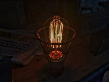 High angle view of illuminated lamp on table