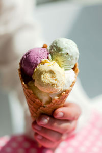 Close-up of hand holding ice cream