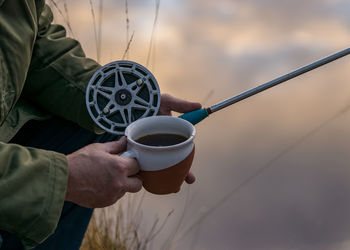 Man holding coffee cup