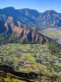 Beautiful view of plantations in a small village surrounded by hills on a beautiful lombok island